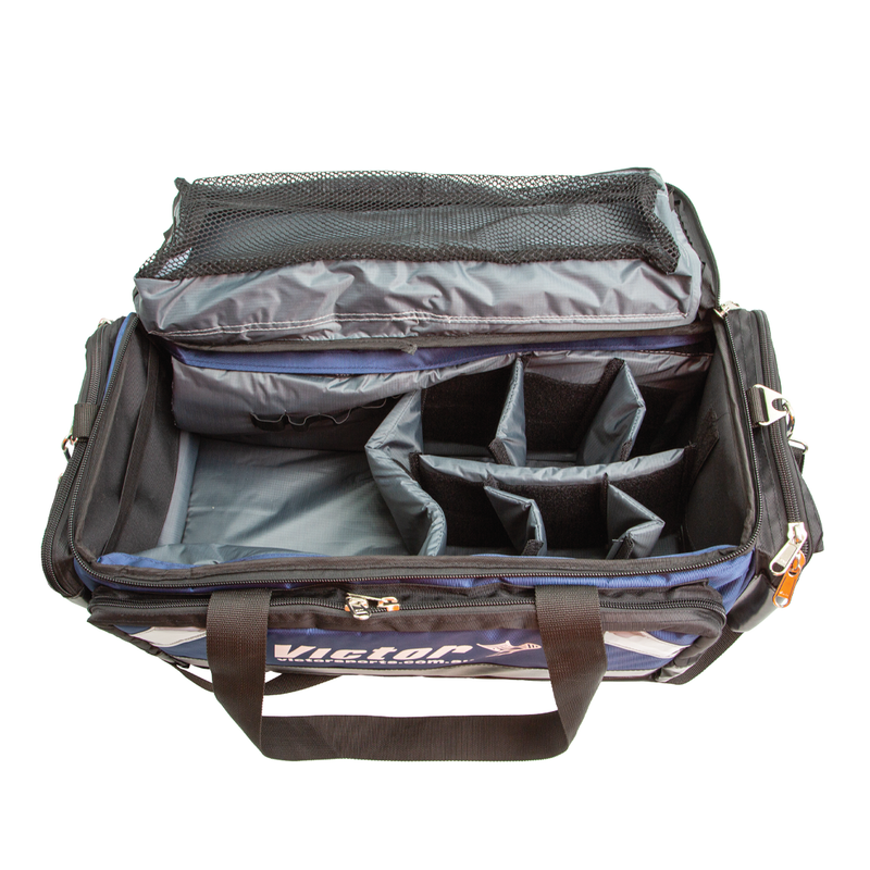 Open travel bag with compartments on a white background